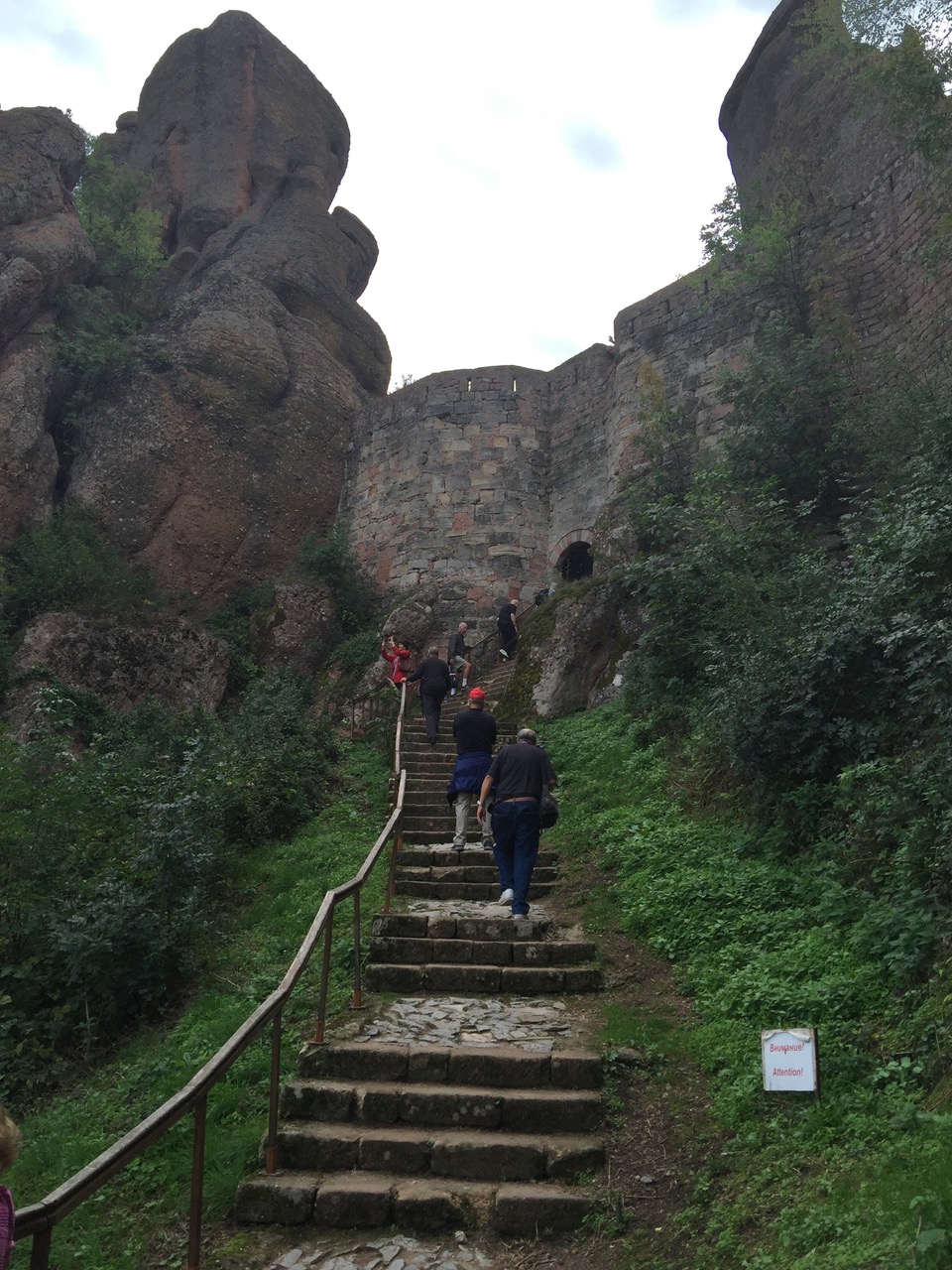 Climbing a set of stairs to the highest point of the fortress tucked between the rocks