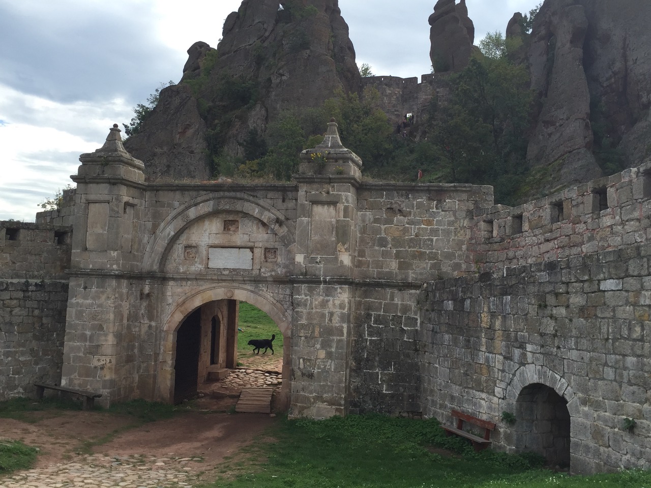 Gate to Belogradchik Fortress with imposing rock formations behind
