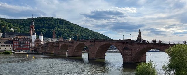 Old Bridge of Heidelberg stretching across the Neckar river on a sunny day
