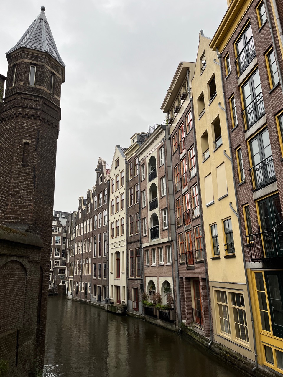 Narrow Amsterdam canal with row houses