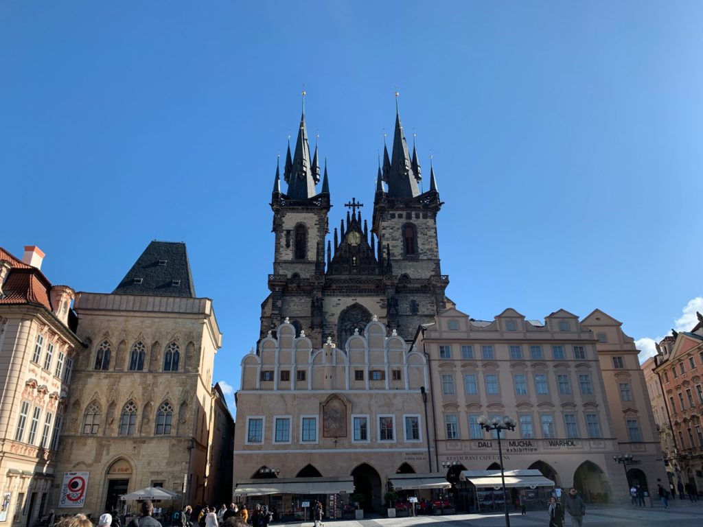 Tyn church in Prague with white stone and a black roof