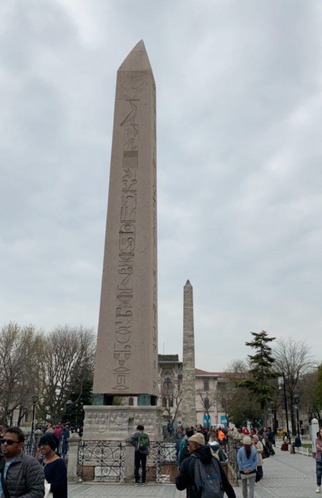 Four sided and pointed Egyptian obelisk with hieroglyphics on each side