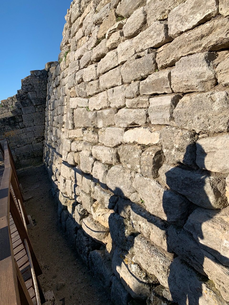A wall with shadowy figures