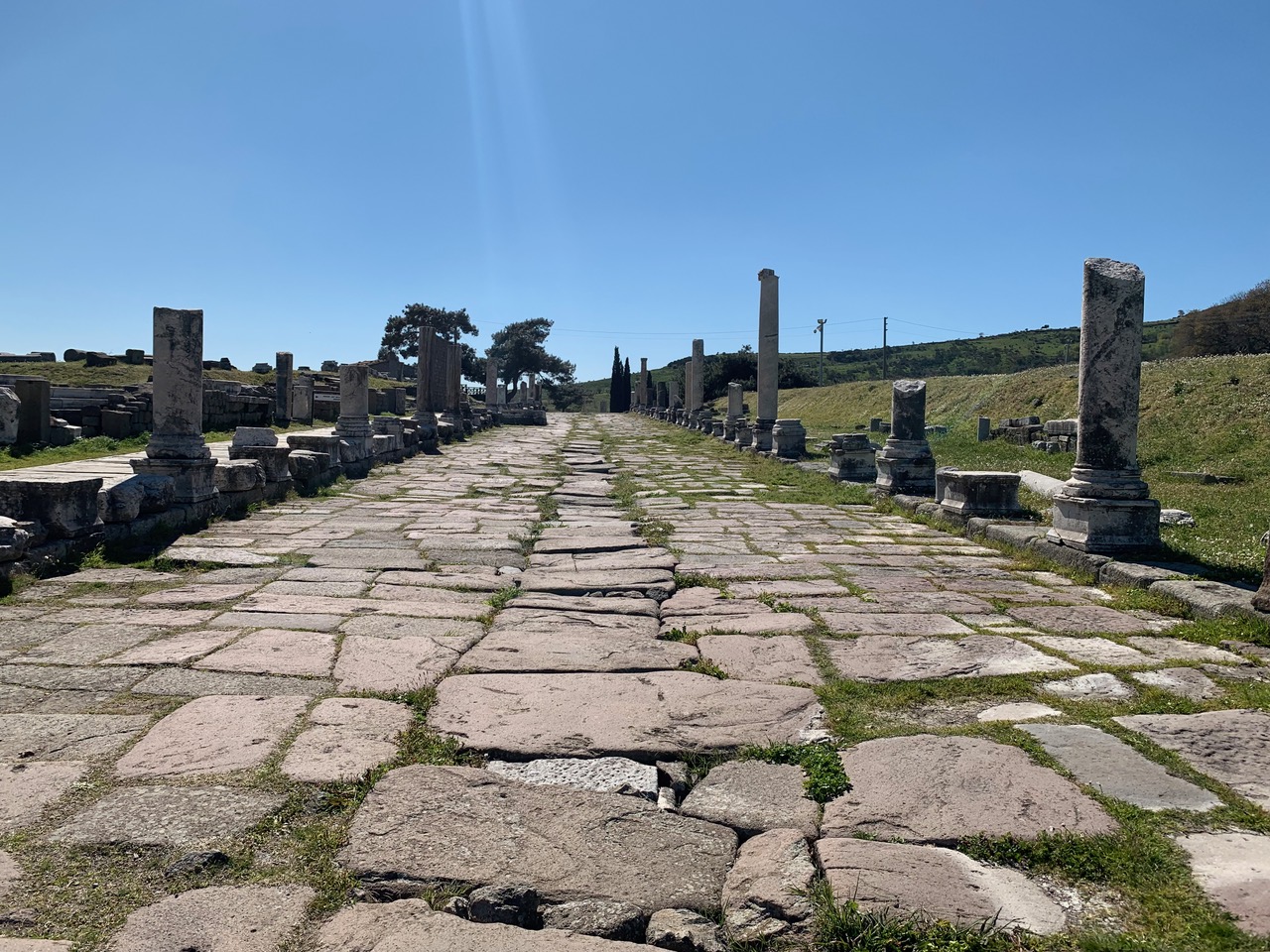 Roman road with half standing arches and drainage drench
