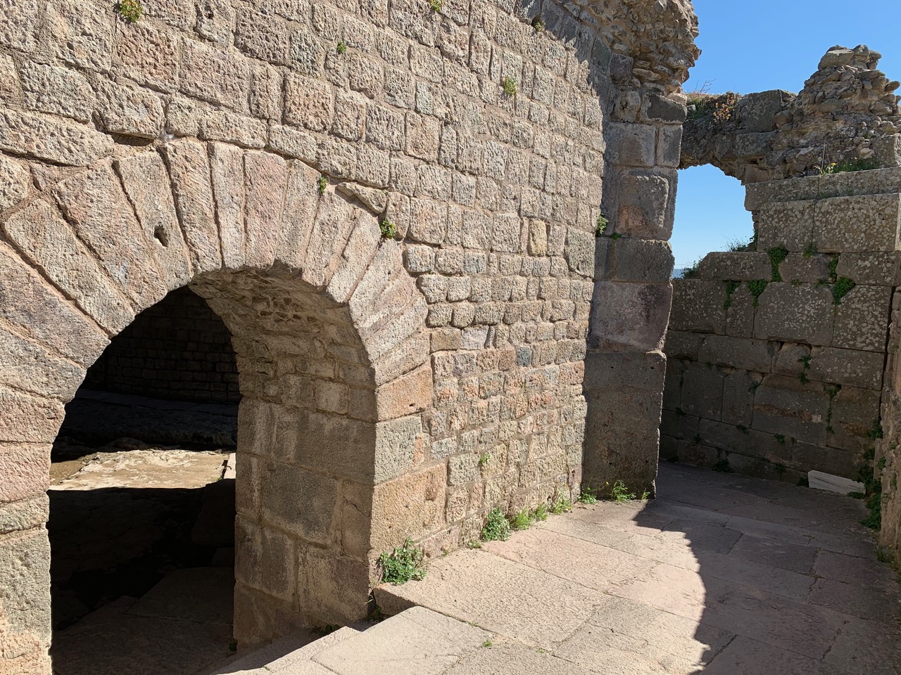 arched doorway in stone wall