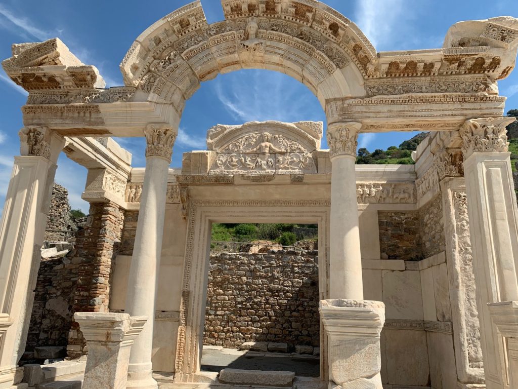 Reconstructed temple of Hadrian with a rounded arch and slender columns