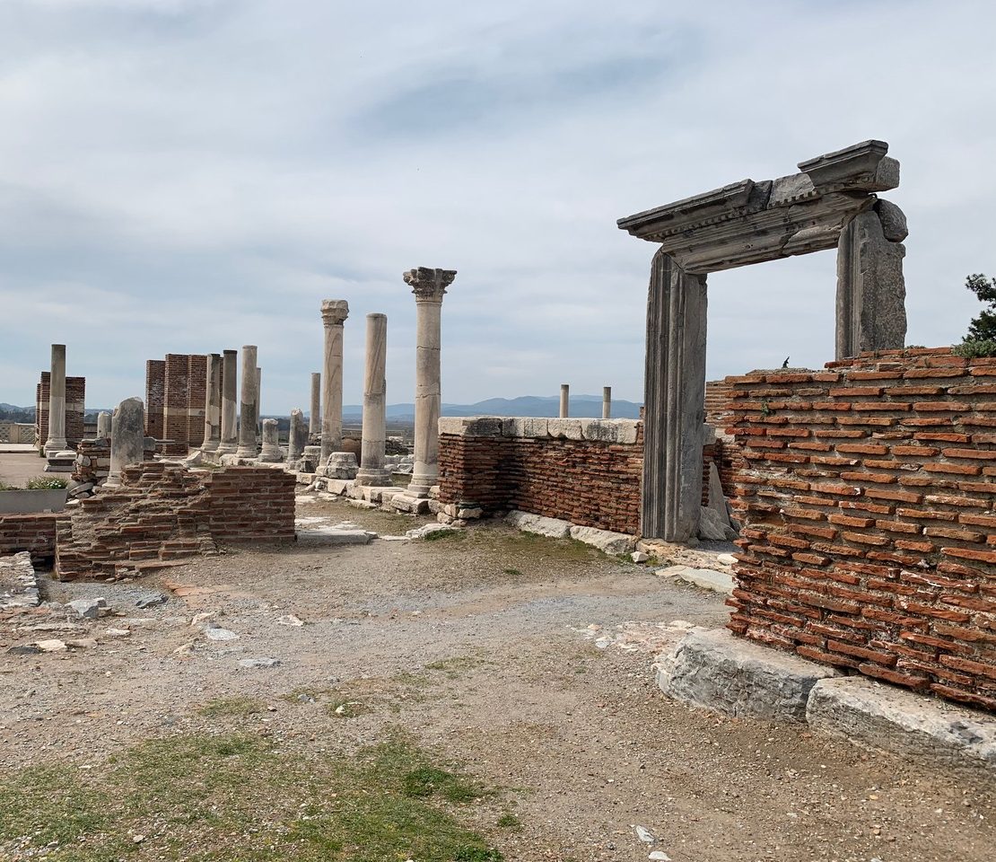 ruins of red brick, door frames, and free standing columns