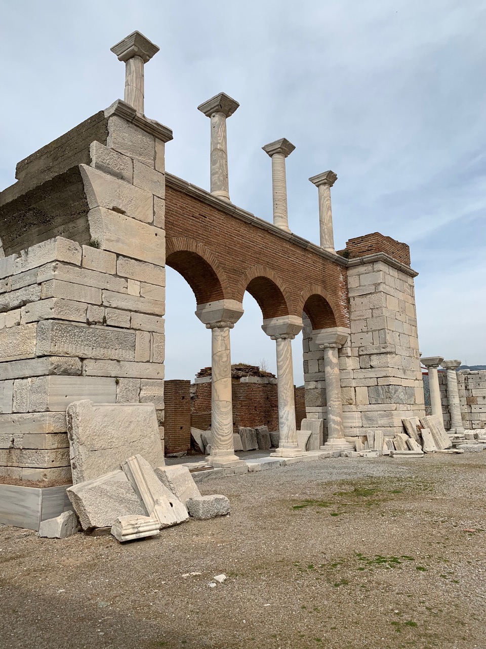 Three rounded arched columns with four more atop