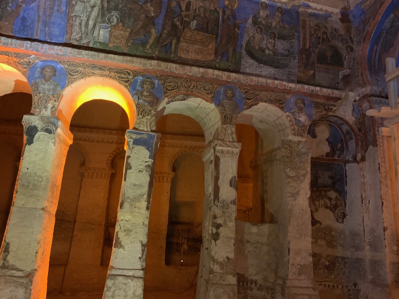 carved pillars and life of Christ frescos in Tokali church with the background a deep blue