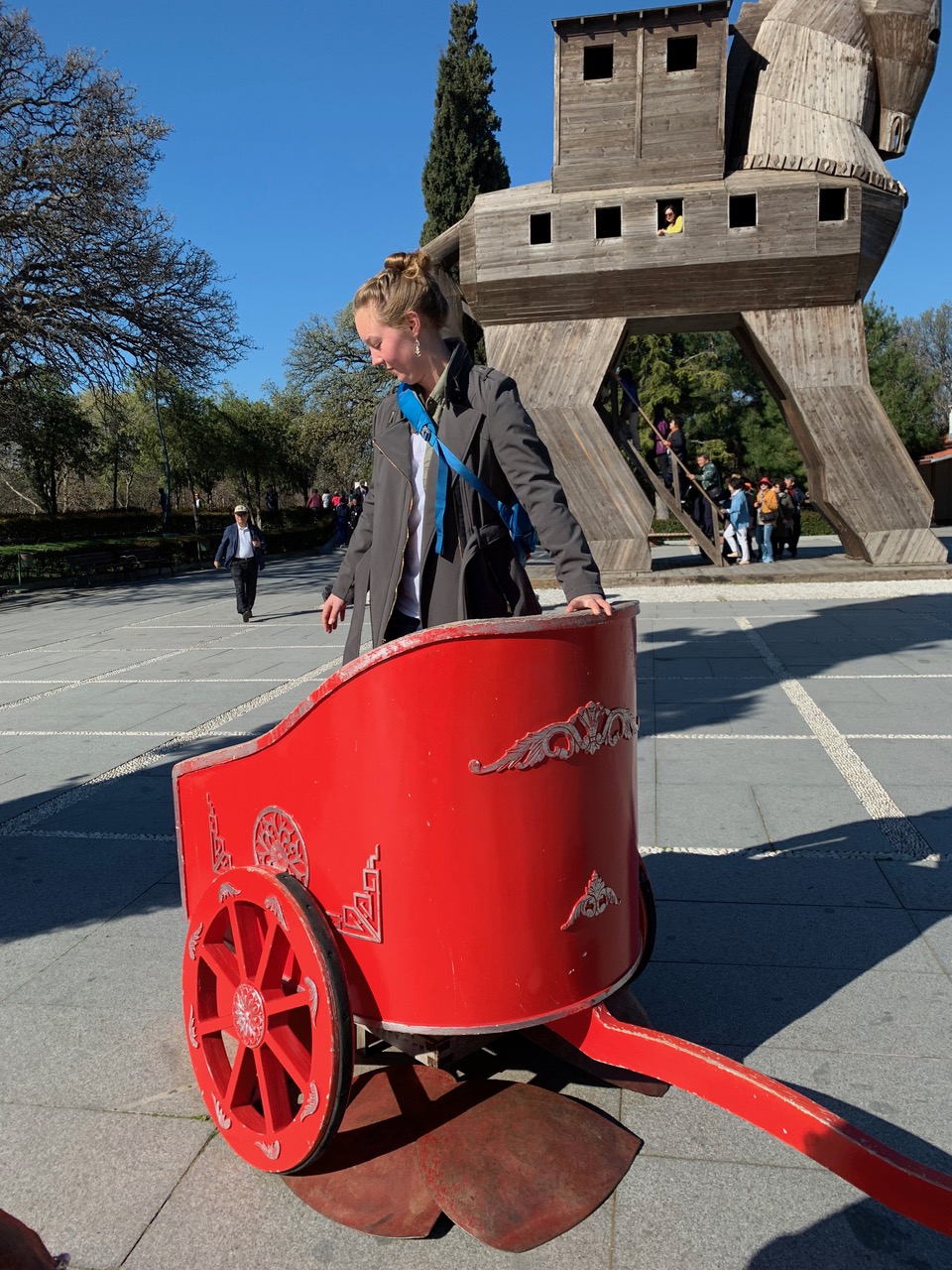 Maddie standing in a red chariot