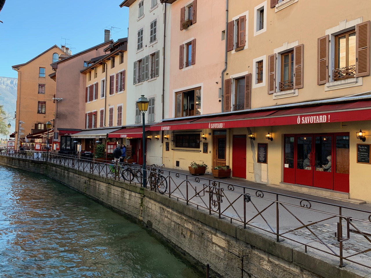 Colorful restaurants besides Annecy's river