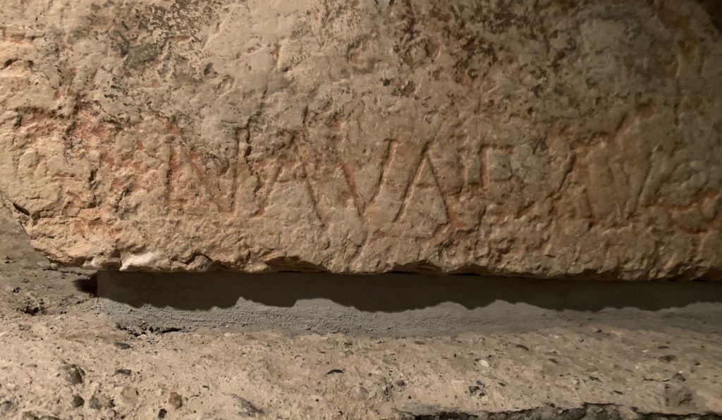 Roman letters carved into a stone