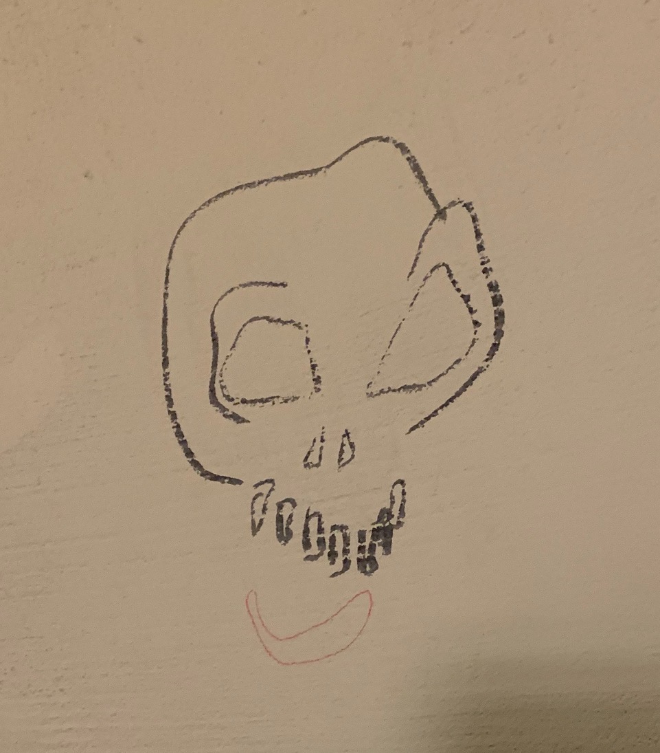 grafiti of a skull outside the catacombs